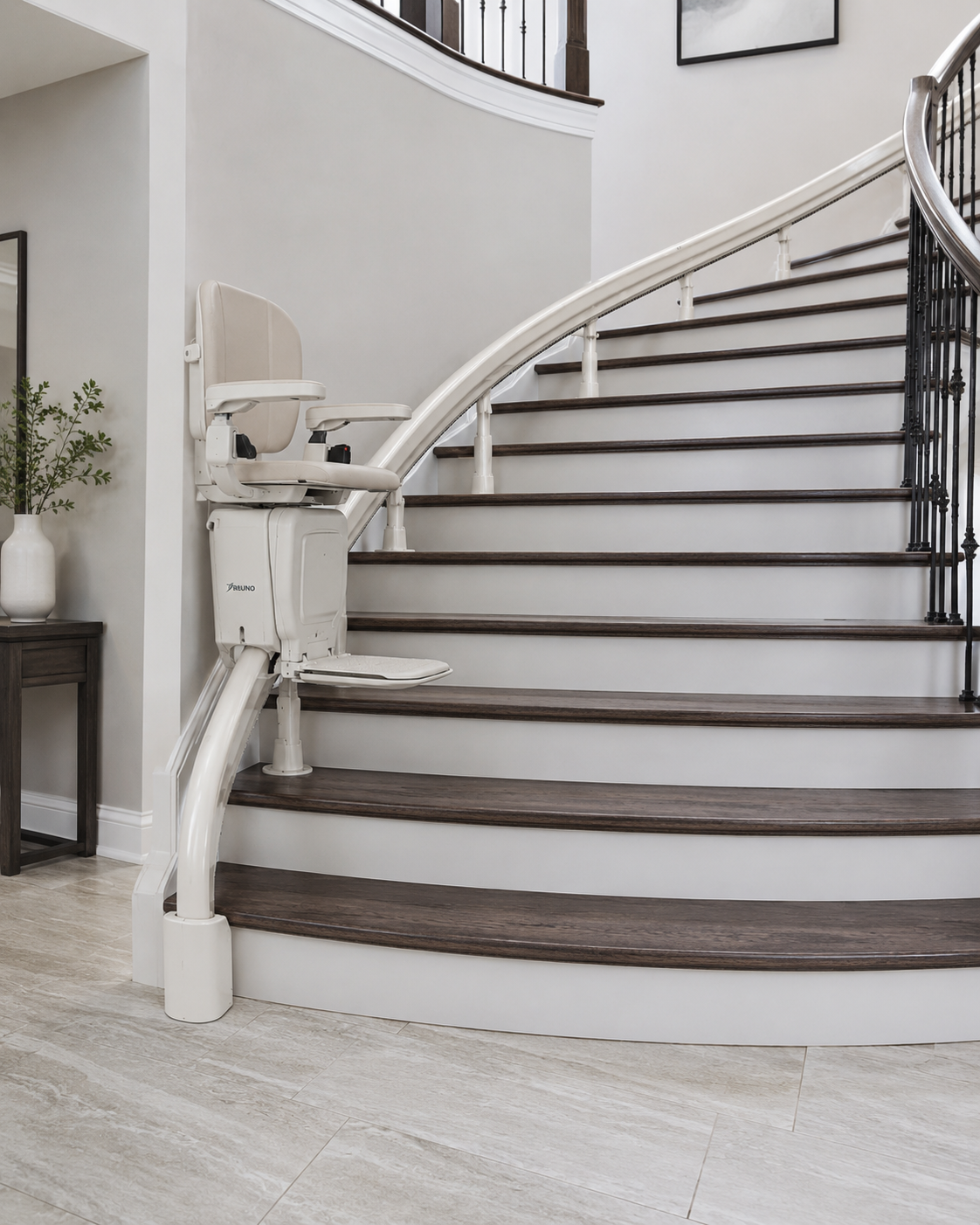 Bruno Elite curved indoor stairlift — custom curved stairlift for L-shaped staircases